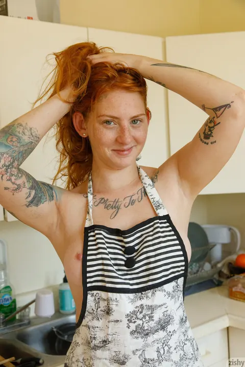 Pale Redhead with Tattoos Undresses and Poses Nude – photo 8 of 12