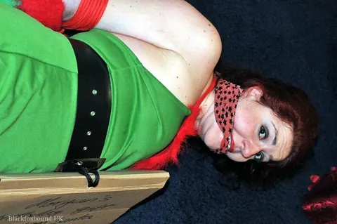 Redhead in Christmas Costume and Panties Is Bound and Gagged – photo 7 of 16
