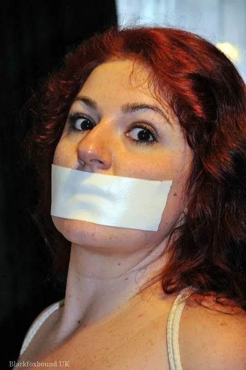 Redhead in Christmas Costume and Panties Is Bound and Gagged – photo 10 of 16