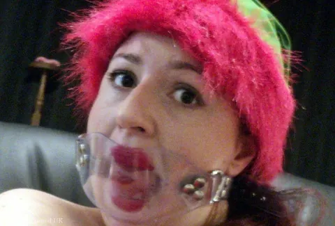 Redhead in Christmas Costume and Panties Is Bound and Gagged – photo 14 of 16