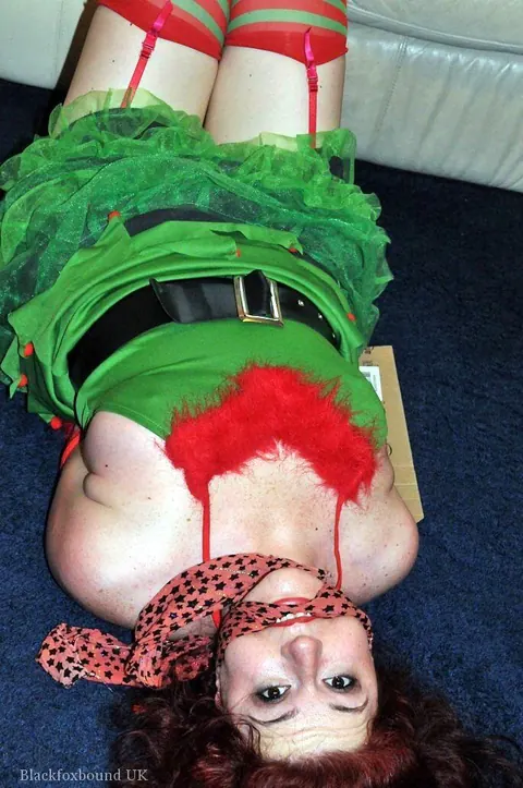 Redhead in Christmas Costume and Panties Is Bound and Gagged – photo 4 of 16
