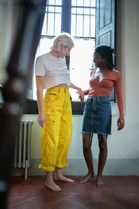 Mae Lynn: Short-Haired Blonde and Ebony Woman Kiss by the Window – photo 20 of 21