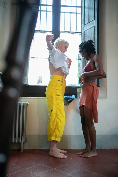 Mae Lynn: Short-Haired Blonde and Ebony Woman Kiss by the Window – photo 14 of 21