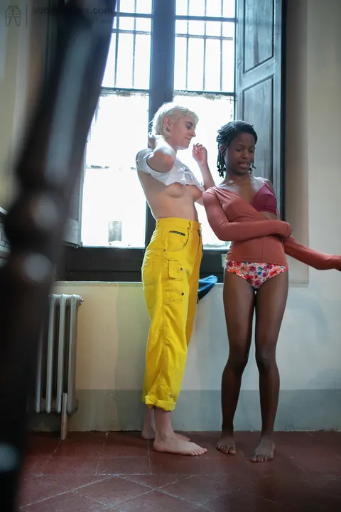 Mae Lynn: Short-Haired Blonde and Ebony Woman Kiss by the Window – photo 15 of 21