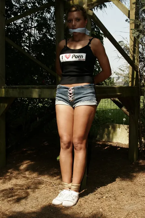 Blonde Tied to a Wooden Frame in the Forest – photo 1 of 17