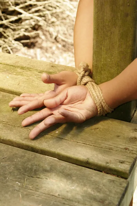 Blonde Tied to a Wooden Frame in the Forest – photo 8 of 17