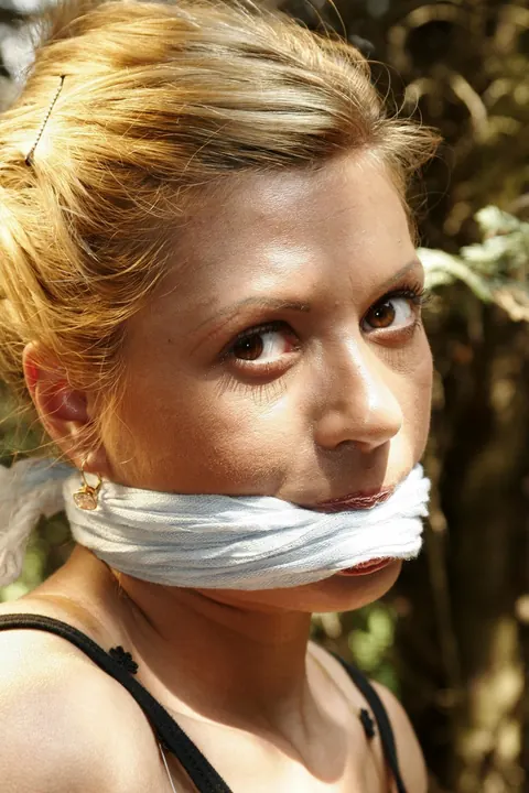 Blonde Tied to a Wooden Frame in the Forest – photo 13 of 17