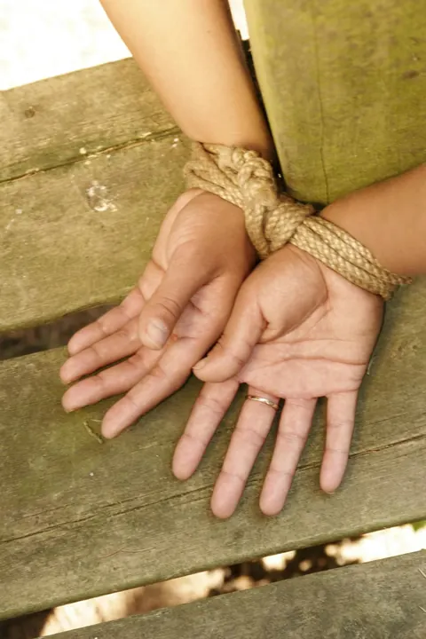 Blonde Tied to a Wooden Frame in the Forest – photo 9 of 17