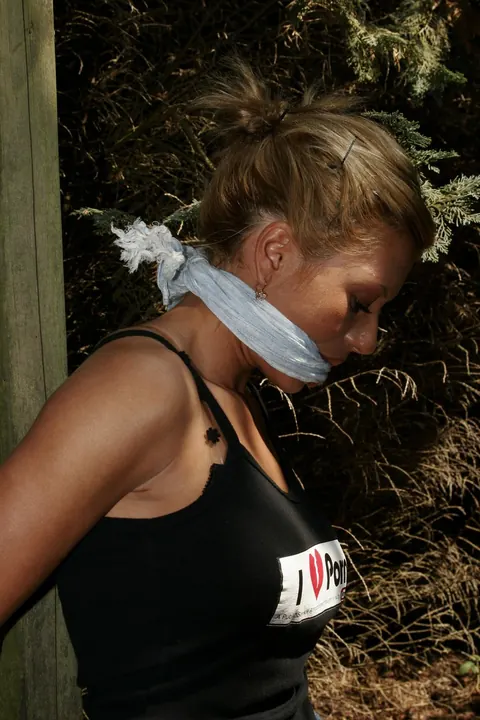Blonde Tied to a Wooden Frame in the Forest – photo 3 of 17