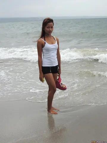 Slim Filipina Strips Naked on the Beach and Takes a Cumshot