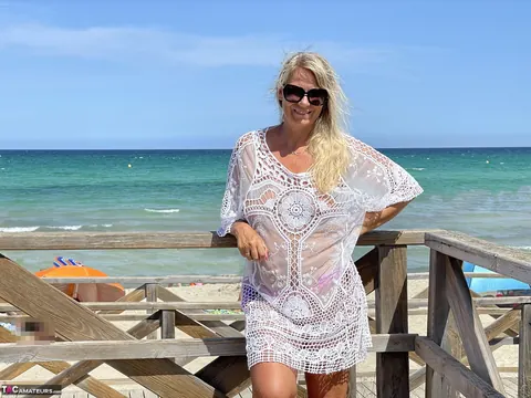 Sweet Susi: Blonde MILF Flashes Her Big Tits and Ass on the Beach – photo 10 of 16