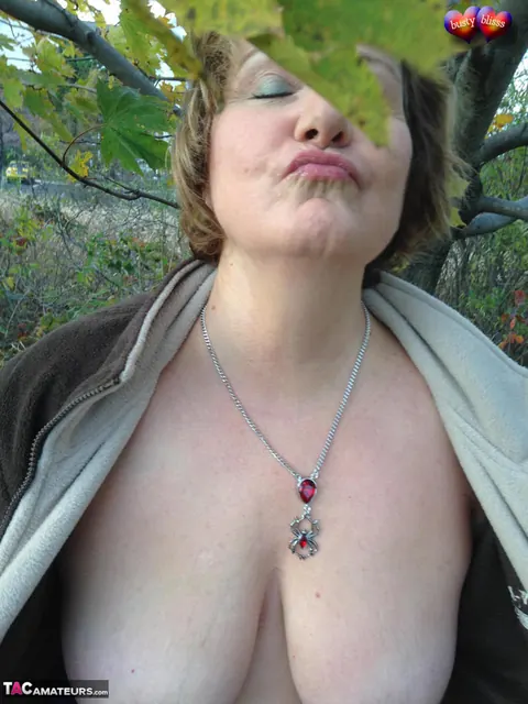 Bustybliss: Mature Curvy Brunette Undresses Outdoors Under a Tree – photo 9 of 20