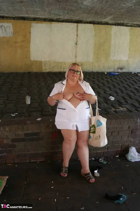 Lexie Cummings: Mature Blonde Nurse in Glasses Strips Naked on Sidewalk – photo 12 of 19