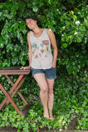 Thick Brunette Strips Out of Her Shorts Outdoors
