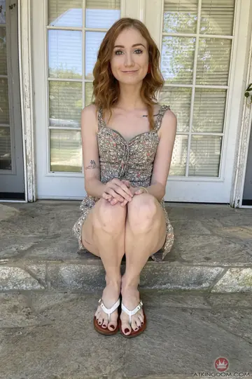 Scarlet Skies – Petite Redhead Spreads Her Protruding Labia on the Beach