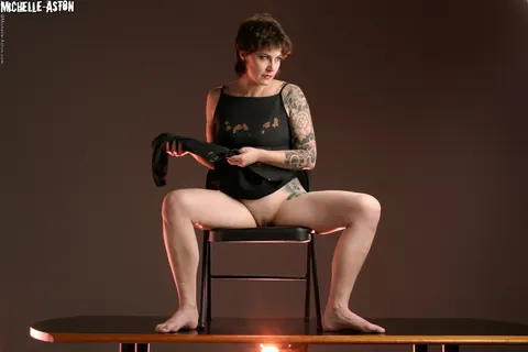 Michelle Aston: Tall Brunette MILF Lifts Her Skirt and Spreads Her Pussy While Seated – photo 15 of 15