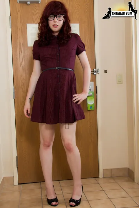 Redhead Trans Woman Lifts Her Skirt and Strips Nude – photo 2 of 16