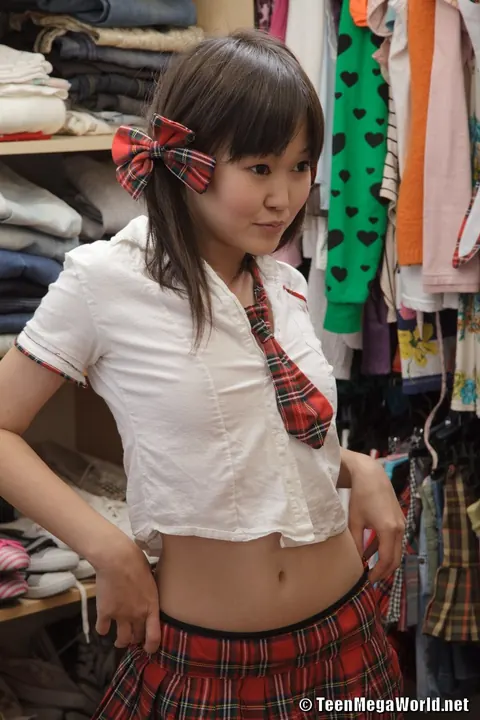 Asian Woman in Uniform Strips and Masturbates in Pigtails – photo 9 of 21