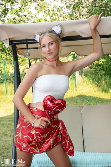 Blonde Strips Out of Her Panties and Spreads on a Bench Swing Outdoors