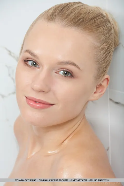 Blonde Flaunts Her Small Tits and Shaved Pussy in the Bathroom – photo 18 of 18