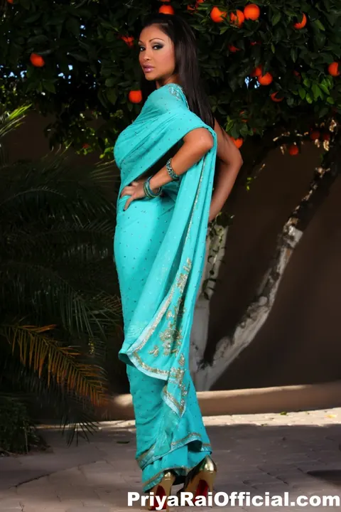 Priya Anjali Rai: Busty Indian MILF in Heels Flashes Her Shaved Pussy in the Garden – photo 10 of 12