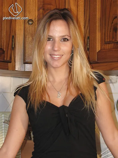 Blonde in Pantyhose and Shorts Poses for Foot Fetish – photo 1 of 16