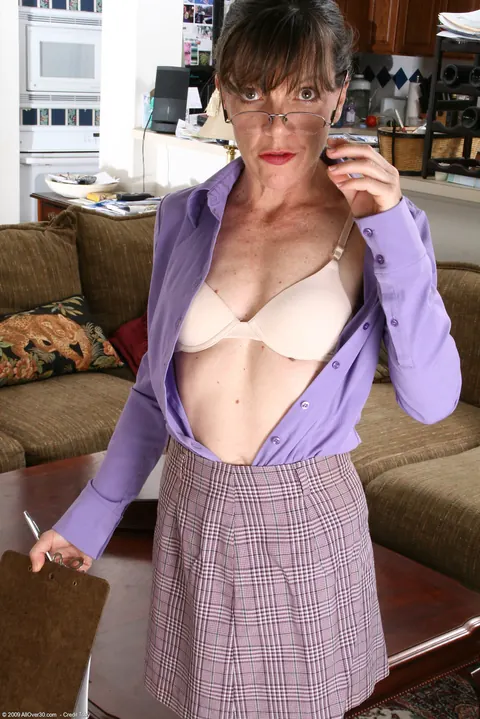 Mature Woman in Glasses Strips and Shows Her Hairy Pussy – photo 3 of 21