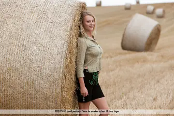 Carisha – European Blonde with Big Tits Undresses by a Hay Bale