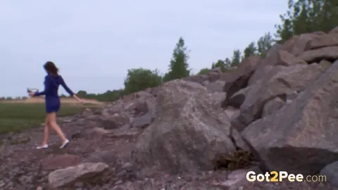 Woman in Stockings Squats on Boulders to Piss Outdoors – photo 15 of 15