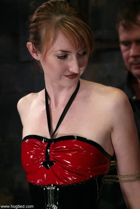 Kendra James: Redhead Tied Up in a Latex Skirt and Boots – photo 3 of 21