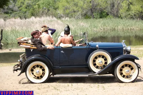 Woman Poses Clothed by a Car Outdoors – photo 1 of 15