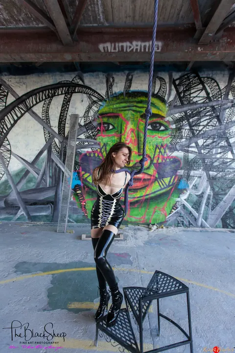 PAWG in a Latex Skirt and Heels Stands with Arms Bound – photo 15 of 16