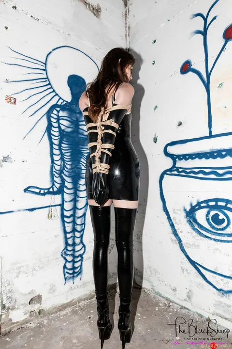 PAWG in a Latex Skirt and Heels Stands with Arms Bound – photo 5 of 16