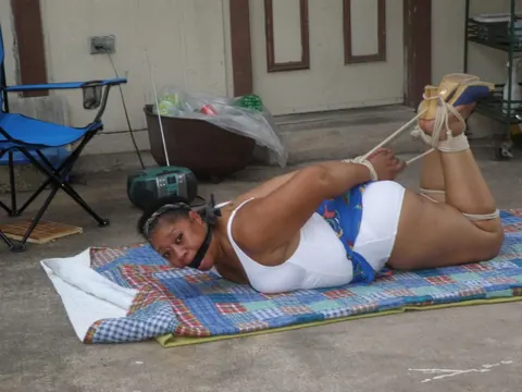 Mature Ebony BBW Hogtied and Cleave Gagged Outdoors – photo 3 of 16