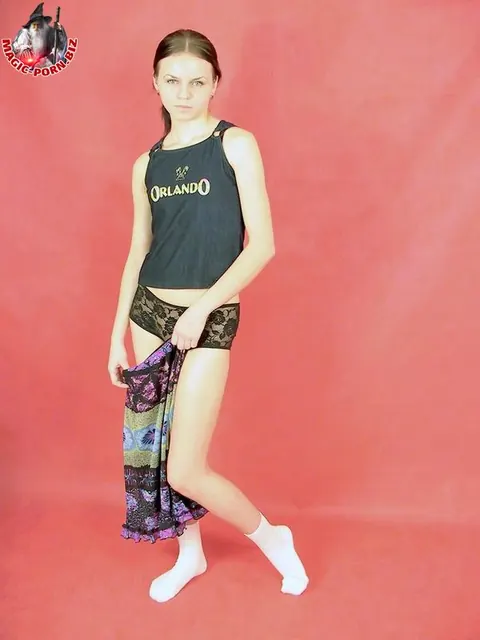 Petite Slim Woman Keeps White Socks On While Undressing to Lingerie – photo 4 of 17