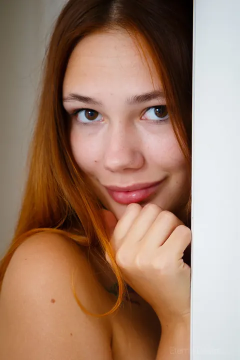 Redhead Spreads Her Shaved Pussy in the Bedroom – photo 16 of 16