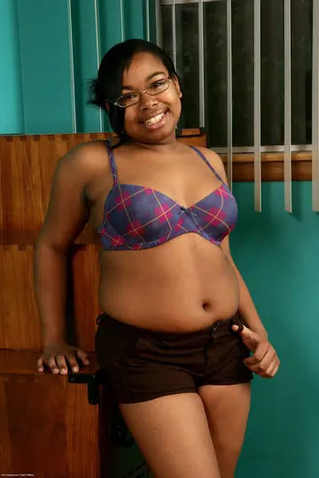 Ebony BBW in Glasses Poses Nude and Shows Her Hairy Pussy