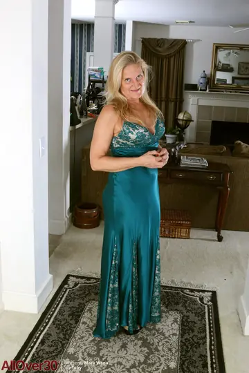 Mature Blonde Strips Out of Her Skirt and Heels to Flash Her Big Tits