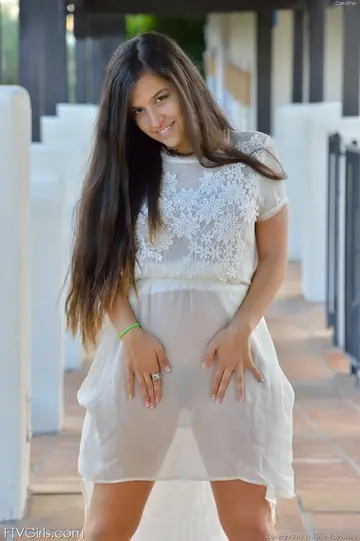 Busty Woman Lifts Her Dress to Finger Her Hairy Pussy with Banana