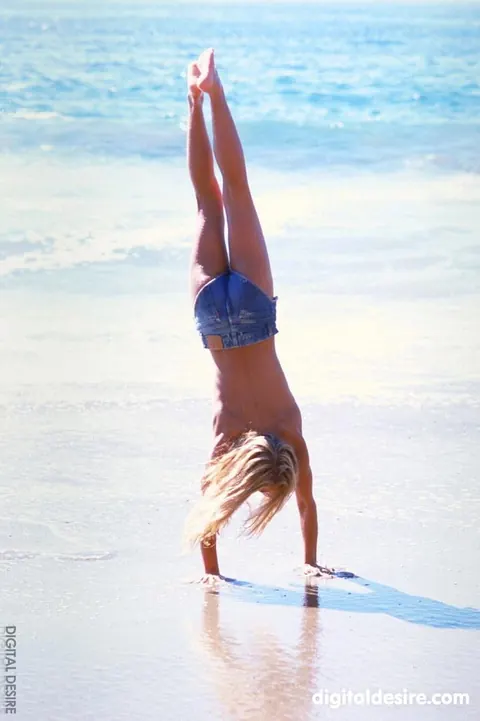 Slim Blonde Undresses and Poses Nude on the Beach – photo 12 of 20
