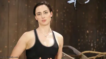 Brunette Suspended in Rope Bondage Mid-Yoga Stretch