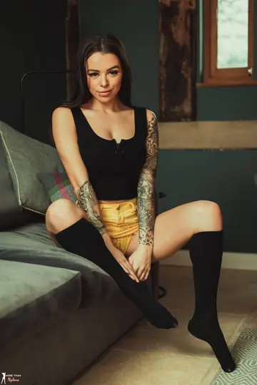 Tattooed Brunette Reveals Her Big Tits in Lingerie and Knee Socks