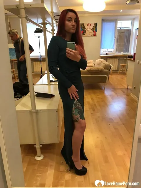 Mature Redhead Reveals Her Tits and Tattooed Body by the Mirror – photo 4 of 21
