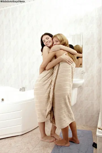 Blonde and Brunette Play with Toys in the Bathroom