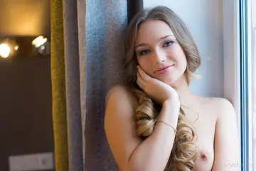 Tall Blonde with Natural Tits Spreads on the Windowsill