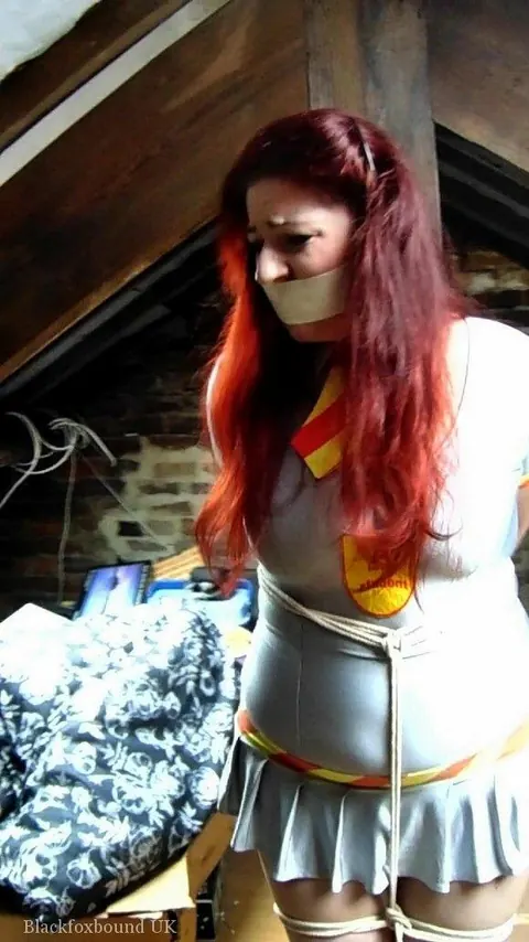 Redhead Tied to a Post in Uniform and Heels in the Attic – photo 3 of 16