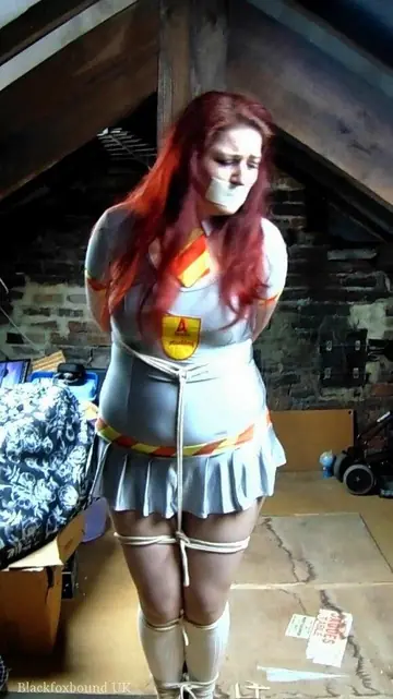 Redhead Tied to a Post in Uniform and Heels in the Attic