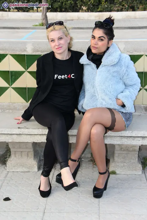 Two Women in Pantyhose Kiss and Play with Feet Outdoors – photo 1 of 12