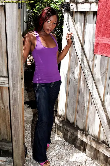 Ebony Brunette in Jeans and Heels Spreads Outdoors