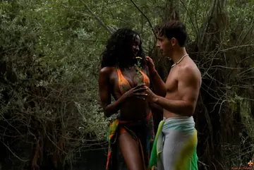 Thick Ebony Babe Shows Her Tits and Ass Outdoors Near Water